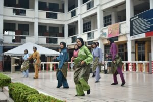 Malaysian family celebrating Hari Raya Aidilfitri with traditional dishes and decorations.
