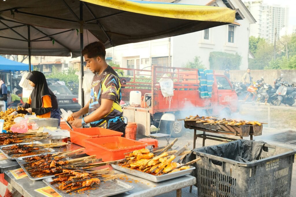 Fresh sugarcane juice being pressed at a lively Penang night market