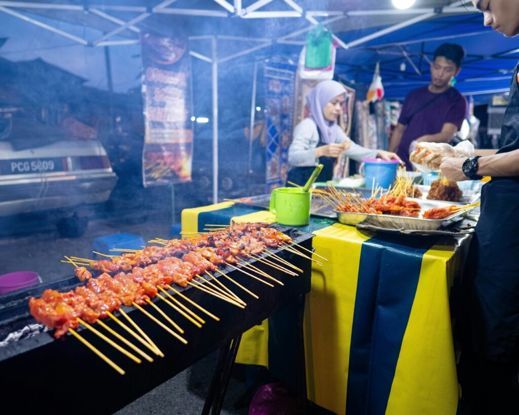 Grilled chicken and beef saty skewers served with spicy peanut sauce in penang